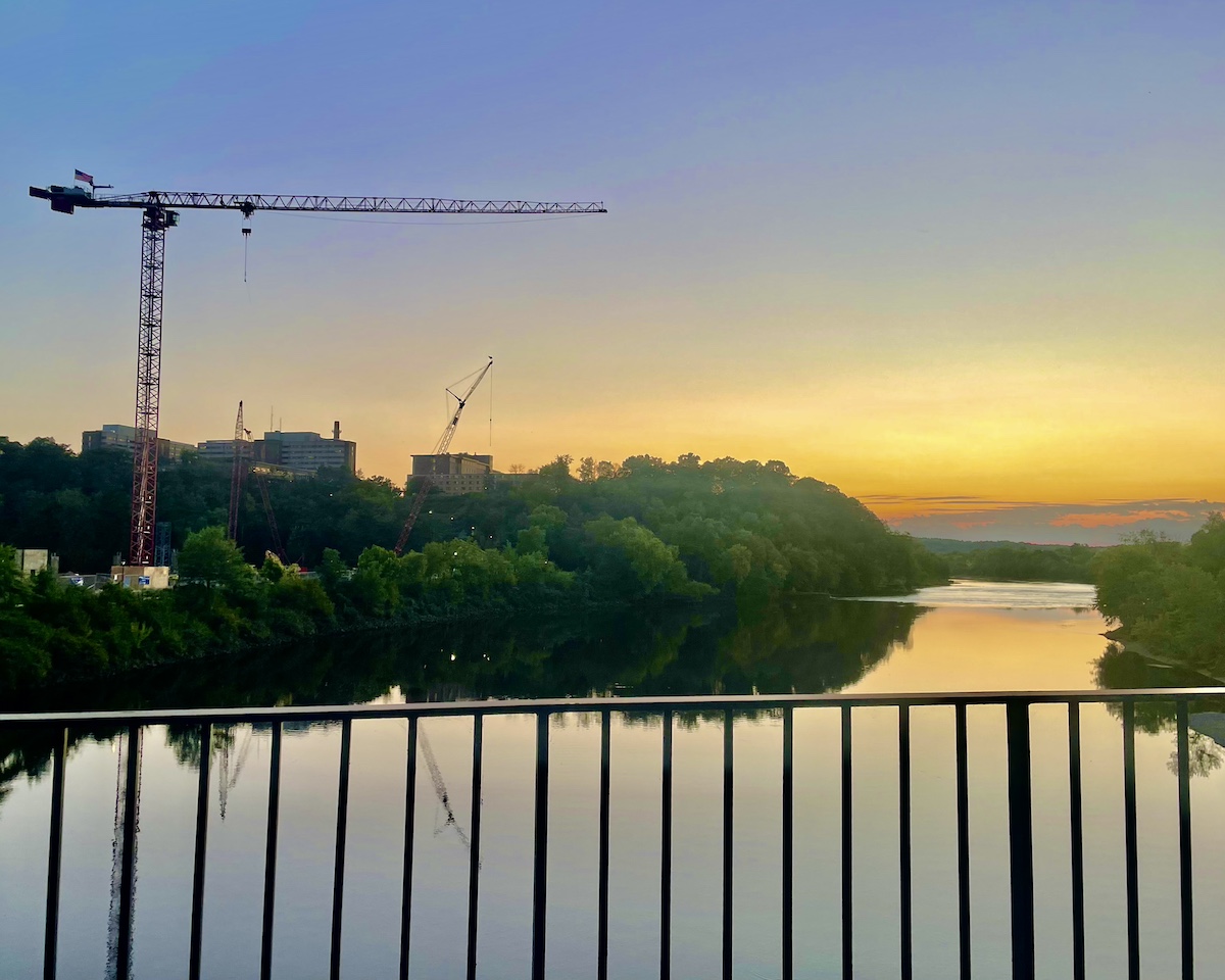 Equipment from ongoing construction of the new Science and Health Sciences Building juts out against the UW-Eau Claire skyline.