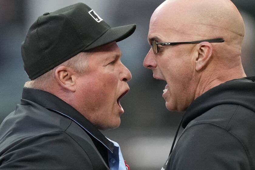 Pedro Grifol and home plate umpire Marvin Hudson get into an argument after Grifol is ejected from an April 28, 2023 game against the Tampa Bay Rays.