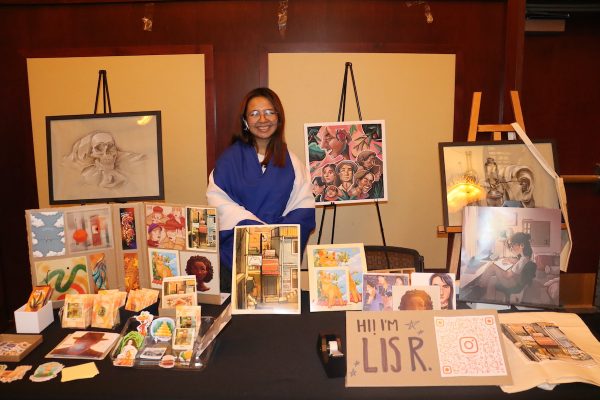 Recinos wrapped in the flag of El Salvador, representing her culture and broadcasting her artwork.