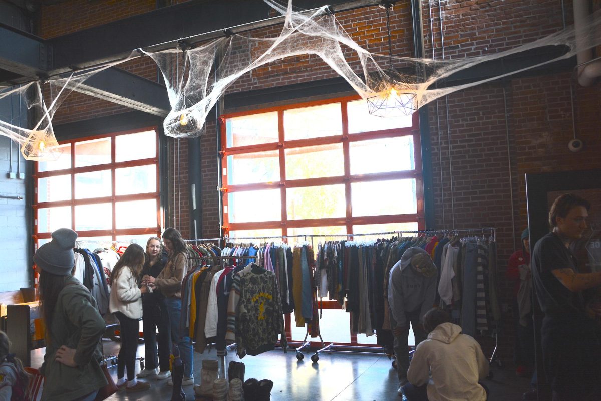 The Brewing Projekt is decked out for Halloween with cobwebs, lights and other festive decor.
