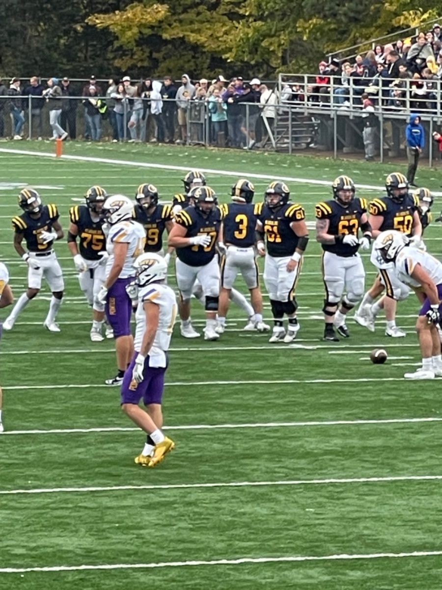 The Blugolds break the offensive huddle.