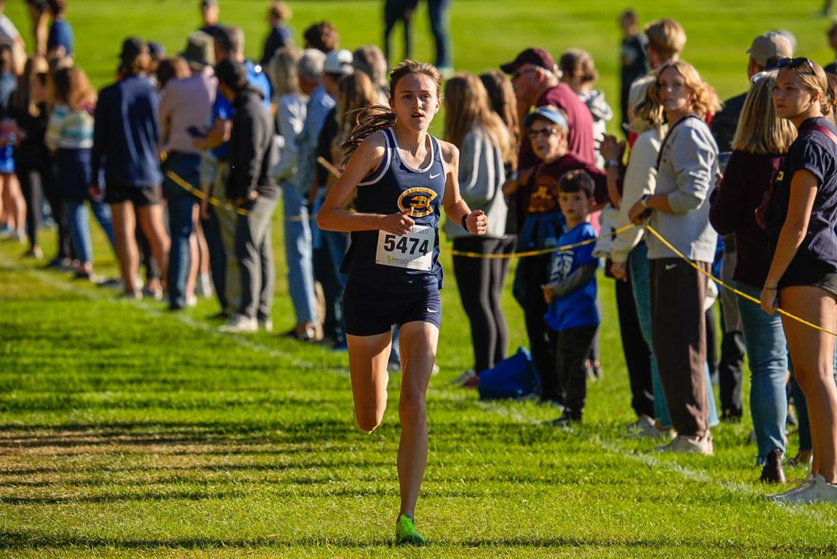 Keeley Behr running at the Blugold Invitational in Colfax, Wisconsin.