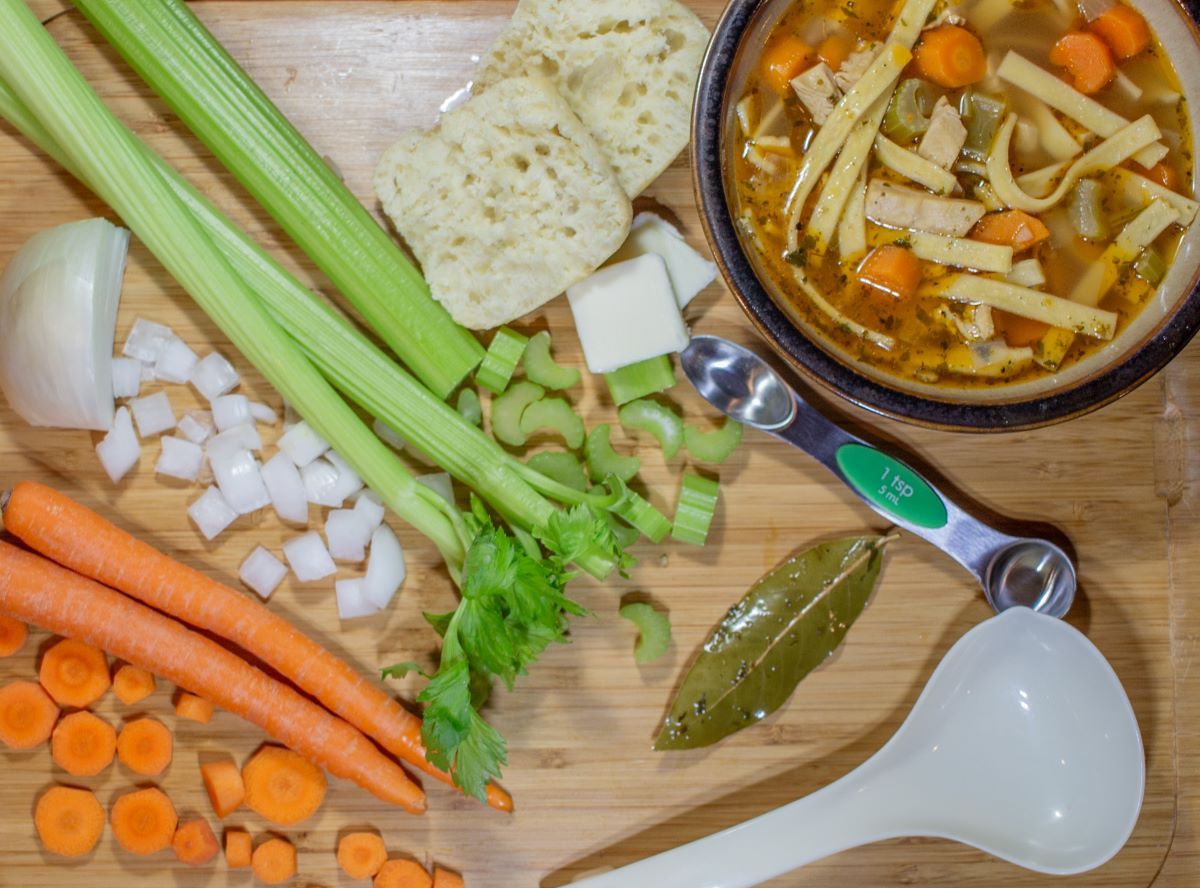 Some of the ingredients used, along with the mouthwatering final product and a dinner roll.