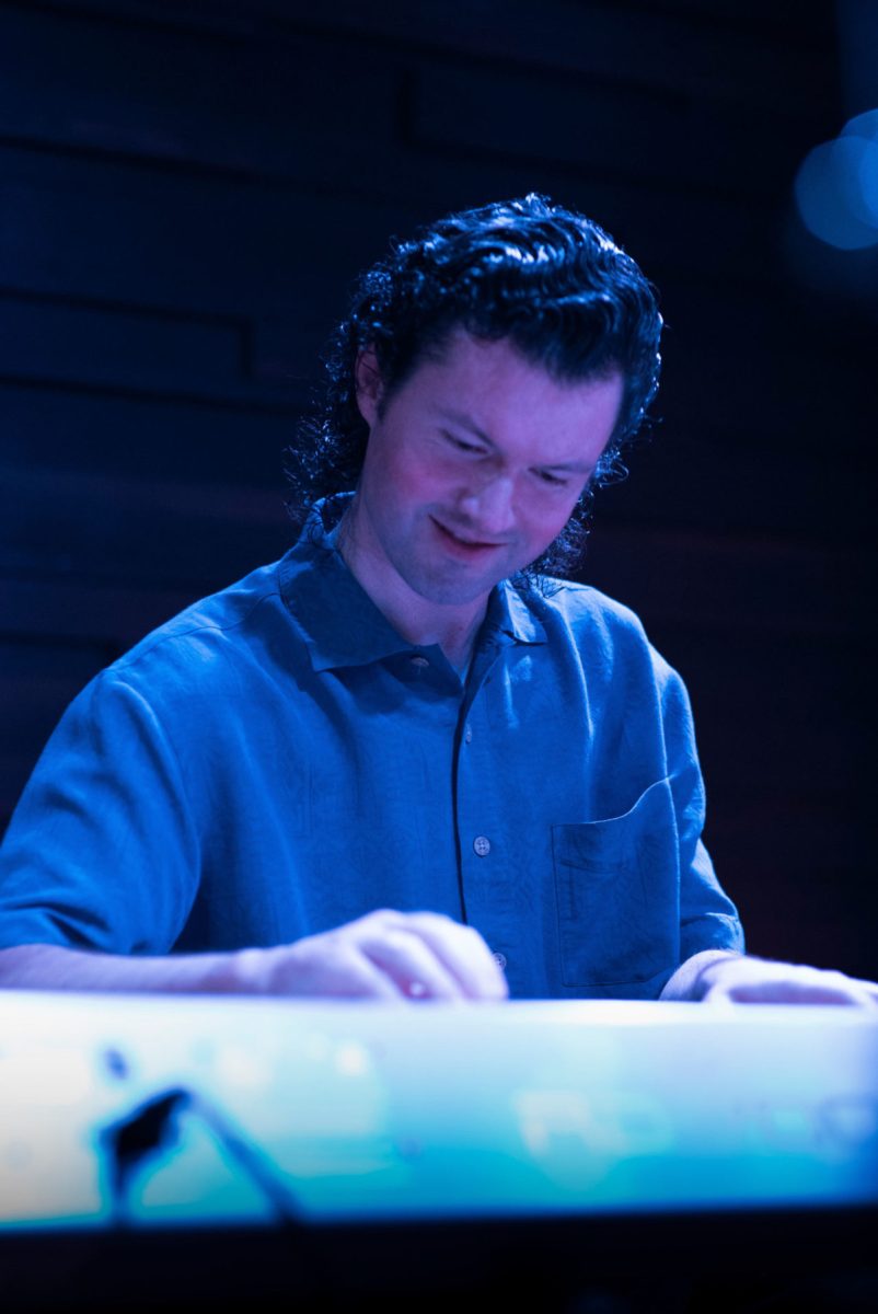 Josh Gallagher plays piano on stage at The Lakely.