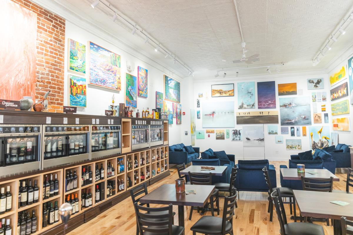 The walls in 2 Roots Art and Wine on Barstow are covered in paintings
