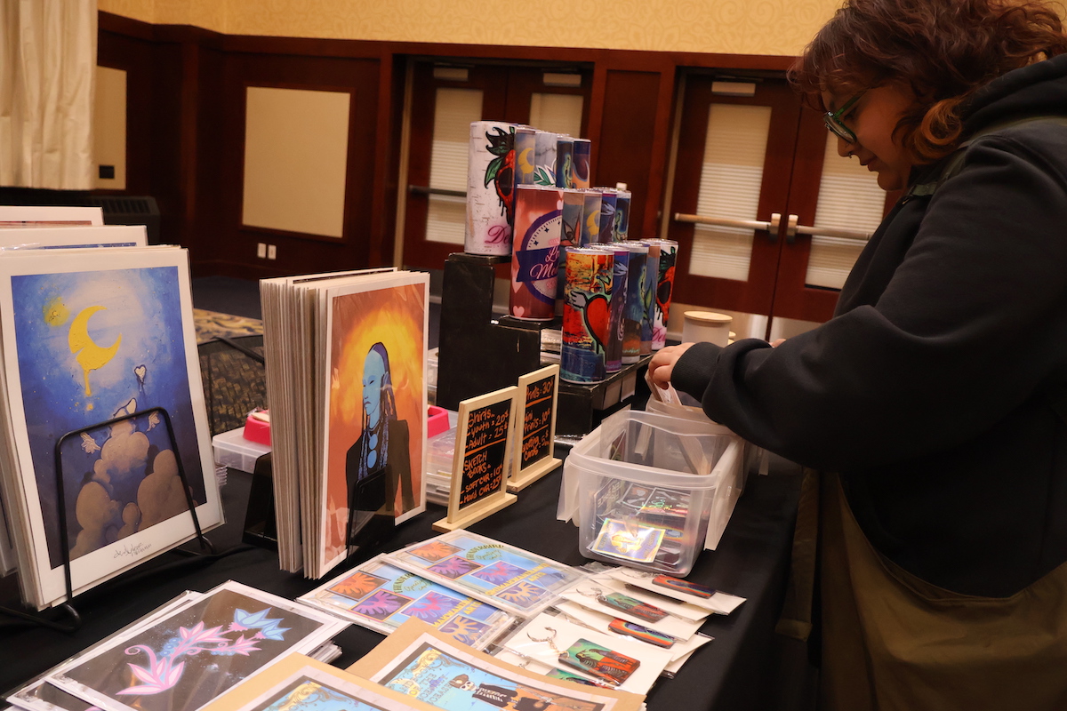 An UW-Eau Claire student sorts through local Indigenous art for sale. The Inter-Tribal Student Council held the first Indigenous Market at UW-Eau Claire.
