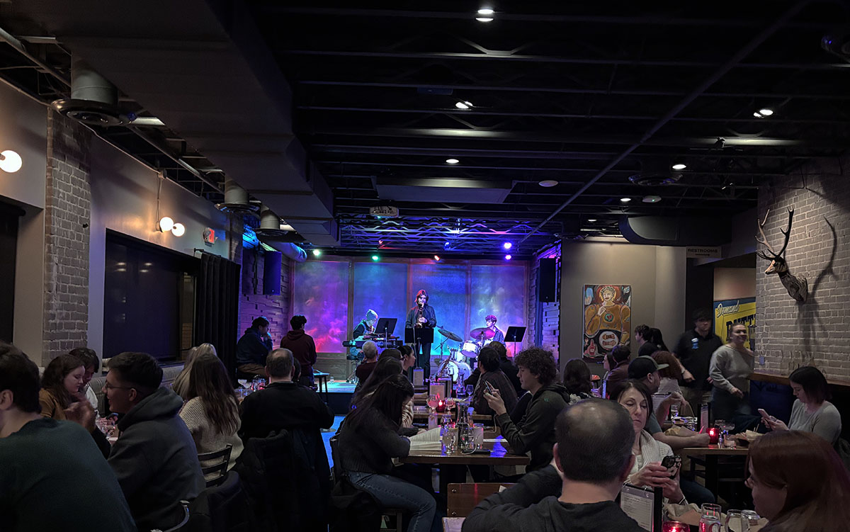 The Lakely event space packed with visitors listening to Chroma perform.
